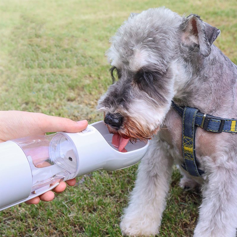 Portable dog water bottle With built in poop bag dispenser and snack Cup